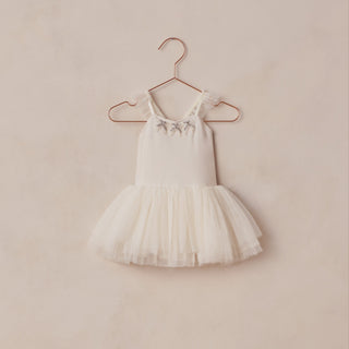 Noralee Clementine Tutu - Ivory
White tutu dress on a hanger against a beige wall