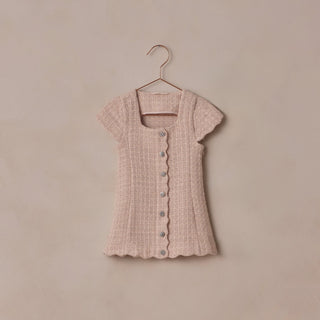 Noralee Gabrielle Dress - Rose
Pink textured dress on a hanger against a beige background