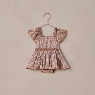 Noralee Margot Romper - Harvest Fleur
Floral baby romper on a beige hanger against a beige background