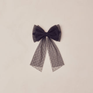 Noralee Alice Bow - Black
Dark purple bow with a sheer overlay on a beige background