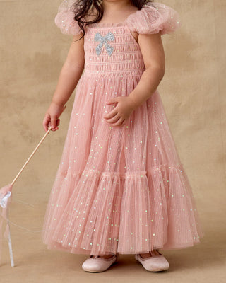 Noralee Clara Dress - Rose
Child wearing a pink dress with a butterfly design on a beige background