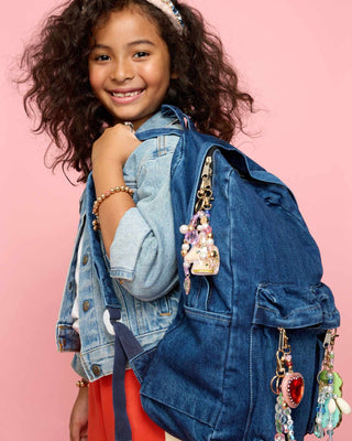 Super Smalls Super Unicorn Bag Charm
Child wearing a denim jacket with colorful charms on a pink background