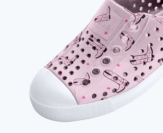 Native Jefferson Print Shoes - Barely Pink / Shell White / Cowgirl
Pink slip-on shoe with dog pattern on a white background