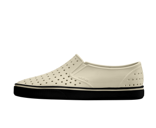 Native Kids Miles - Bone White / Jiffy Black
White slip-on shoe with black sole on a white background