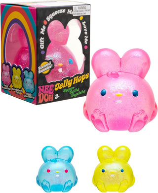 NeeDoh Jelly Hops
Pink, blue, and yellow jelly bean-shaped toys with packaging in the background.