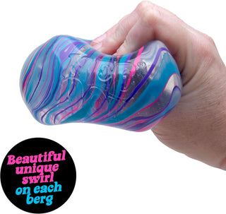 NeeDoh Nice Berg (3.25”) - Swirl 
Hand holding a colorful stress ball with swirling pattern on a white background