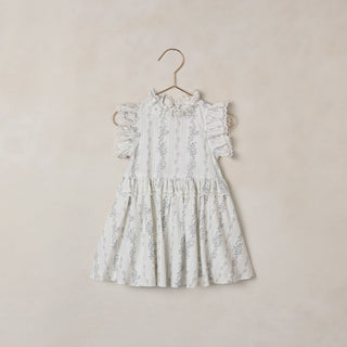 Noralee Alice Dress - French Floral Stripe
White floral dress on a hanger against a beige background