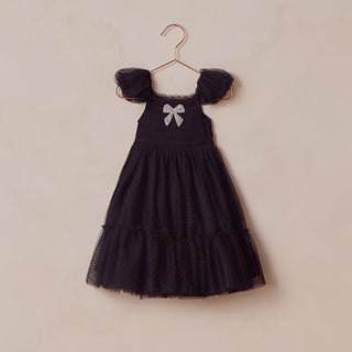 Noralee Clara Dress - Black
Black dress with a bow detail on a beige background