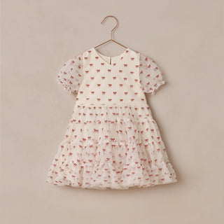 Noralee Dottie Dress - Ruby Bows
Children's dress with small red patterns on a beige background