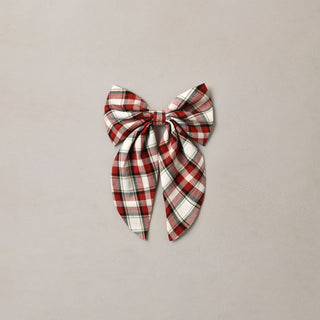 Noralee Everly Bow - Holiday Tartan
A red, white, and black plaid bow hair clip centered on a light gray textured background.