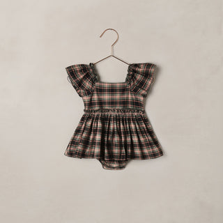 Noralee Margot Romper - Tartan
Plaid baby romper with ruffled sleeves on a beige background