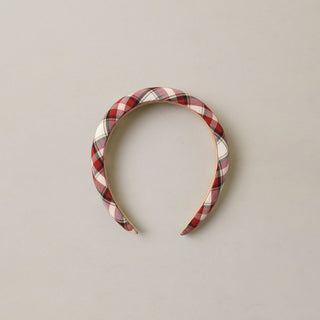 Noralee Padded Headband - Holiday Tartan
A padded fabric headband with a red, white, and black plaid pattern, displayed against a neutral light gray background.