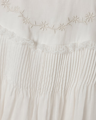 Noralee Penelope Dress - White
Close-up of a white dress with floral embroidery on a plain background