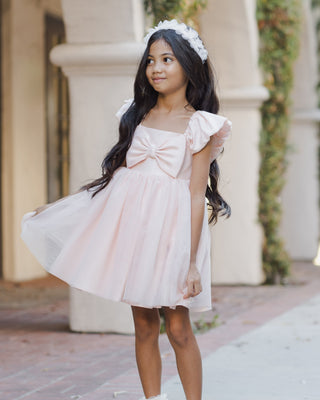 Noralee blush Pixie Headband with soft fabric and delicate design, styled on a person for a casual, elegant look.