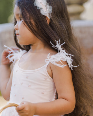 Noralee blush pixie headband with a soft, textured design, styled on a model for a chic, bohemian look.