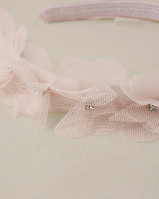 Noralee blush Pixie headband with soft fabric and delicate design, perfect for adding a charming touch to your hairstyle.