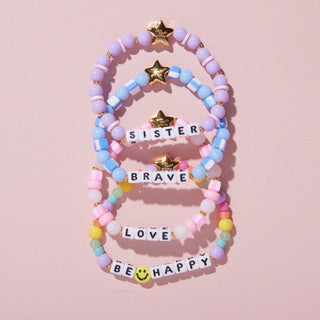 Little Words Project Bracelet - Kids: Sister
Set of colorful beaded bracelets with motivational phrases on a pink background