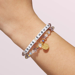 Little Words Project bracelet with "Doing Enough" inscription, silver-tone metal bracelet with engraved motivational message.