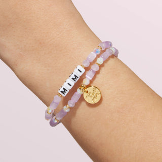Little Words Project Mimi bracelet with engraved word, delicate gold-tone chain, and small charm, stylish and meaningful jewelry piece.