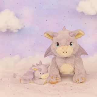 Olli Ella Binky Dragon - Misty
Two plush dragon toys on a soft, cloud-like surface with a pastel sky background.