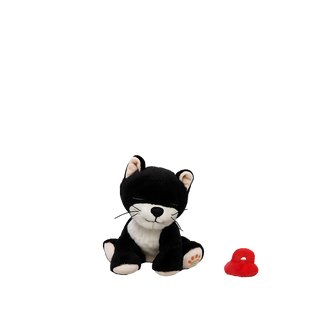 Olli Ella Binky Kitten Kit - Black & White
Black and white plush toy cat with a red object on a white background
