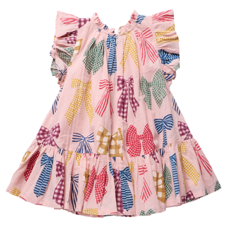 Pink Chicken Girls Harper Dress - Patterned Bows
 A pink children's dress with a colorful bow print, featuring ruffled sleeves, a ruffled neckline, and a tiered skirt, shown against a plain white background.