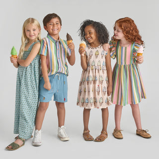 Pink Chicken Girls Elsie Dress - Parade Stripe
Four children in colorful outfits holding ice cream cones against a light gray background