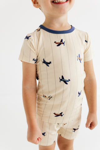 In My Jammers airplane two-piece pajama set with a short-sleeve top and shorts, featuring playful airplane prints on soft fabric.
