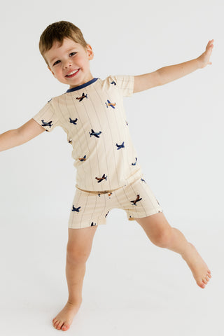 In My Jammers airplane-themed two-piece pajama set featuring a short-sleeve top and shorts with playful airplane prints.