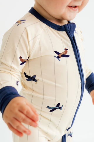 In My Jammers zipper romper pajamas featuring an airplane print, comfortable and playful sleepwear for kids.