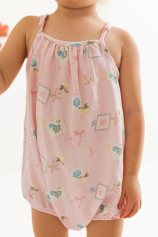 In My Jammers Bubble Romper for little kids featuring coastal notes print, soft fabric, and playful design.