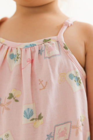 In My Jammers Bubble Romper for kids featuring a coastal notes print with playful, colorful ocean-themed patterns.