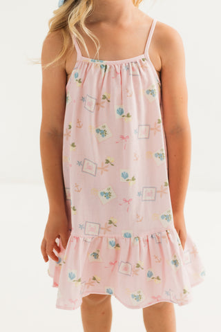 Little coastal notes twirl dress by In My Jammers featuring colorful patterns and a playful, flowy design for girls.