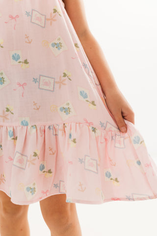 Little coastal notes twirl dress by In My Jammers featuring a playful, colorful pattern and a flowing design for children.