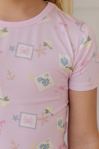 In My Jammers Little Coastal Notes two-piece pajama set with nautical print, featuring a short-sleeve top and matching shorts.