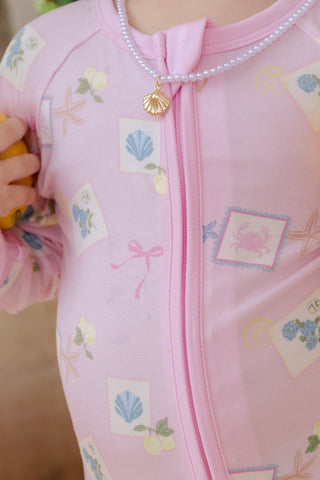 In My Jammers Coastal Notes zipper romper pajamas for kids, featuring a colorful coastal-themed print and front zipper closure.