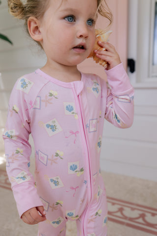 In My Jammers Coastal Notes zipper romper pajamas for kids, featuring a colorful coastal print and comfortable design.