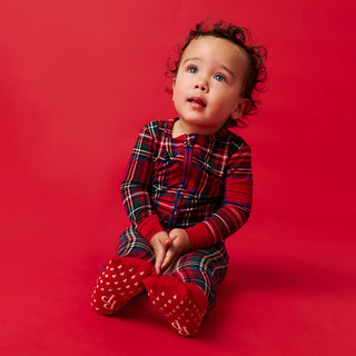 Posh Peanut Convertible One Piece - Red Tartan Plaid
Child wearing a red plaid outfit with white socks on a red background
