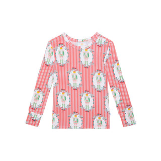Posh Peanut Classic Pajama Set - Sable
Red and white striped shirt with nutcracker pattern on a white background