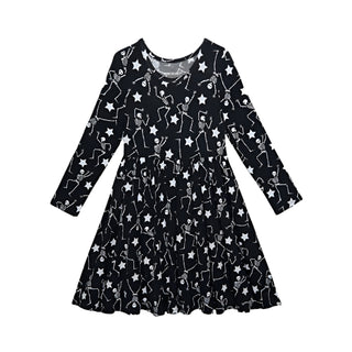 Posh Peanut Funny Bones Glow in the Dark Twirl Dress
Black dress with star pattern on a white background