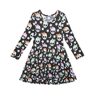 Posh Peanut Kelly Skelly Glow in the Dark Twirl Dress
Children's dress with skull and bow pattern on a white background