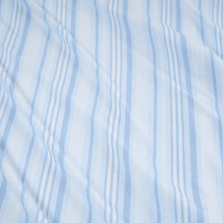 Posh Peanut Footie Zippered One Piece - Richie 
Light blue and white vertically striped fabric texture with a soft, slightly wrinkled surface.