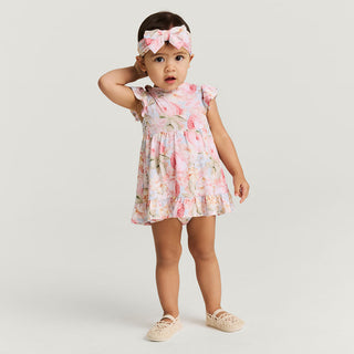Pink Posh Peanut ruffled twirl bodysuit dress in Rose Dreams, featuring a playful design with ruffles and a soft fabric.