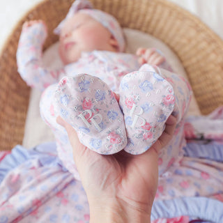 Pink Posh Peanut Footie Ruffled Zippered One Piece for babies, featuring a cozy design with ruffles and zipper closure.