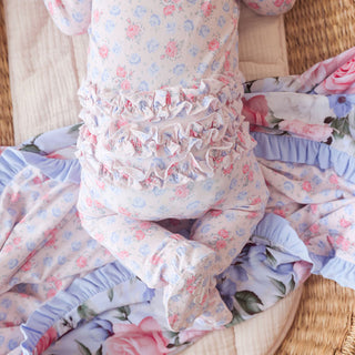 Posh Peanut Laney footie onesie with ruffled zipper details, soft fabric, and cute design for infants.