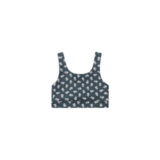 Play by Rylee & Cru Swift Sports Bra - Blue Blooms
A dark slate blue crop top with a white floral pattern, displayed flat against a solid white background.