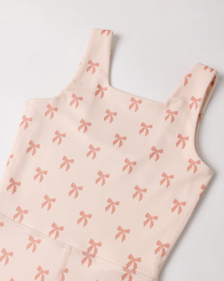 Pink Rylee & Cru Malibu bodysuit leotard with bows, featuring soft fabric and comfortable fit for kids' dance or play.