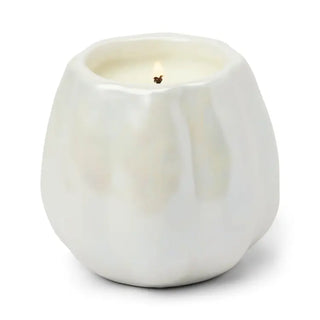 Paddywax White Metallic Pumpkin Candle - Flaming Pumpkin
A white ceramic candle holder with a wick and a small flame, set against a plain white background.
