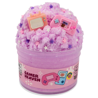 Peachybbies Cloud Slime - Gamer Heaven
A pink glittery slime or wax melt in a clear plastic tub with a 'Gamer Heaven' label, topped with miniature pink and orange handheld game consoles and star-shaped sprinkles, on a white background.