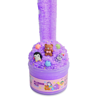 Peachybbies Cloud Slime - Plushie Pile 
A purple slime toy in a clear plastic tub with a pink label reading 'PLUSHIE PILE', topped with fluffy purple slime and small plush character figurines including a penguin, bear, unicorn, and a small rainbow figure, on a white background.